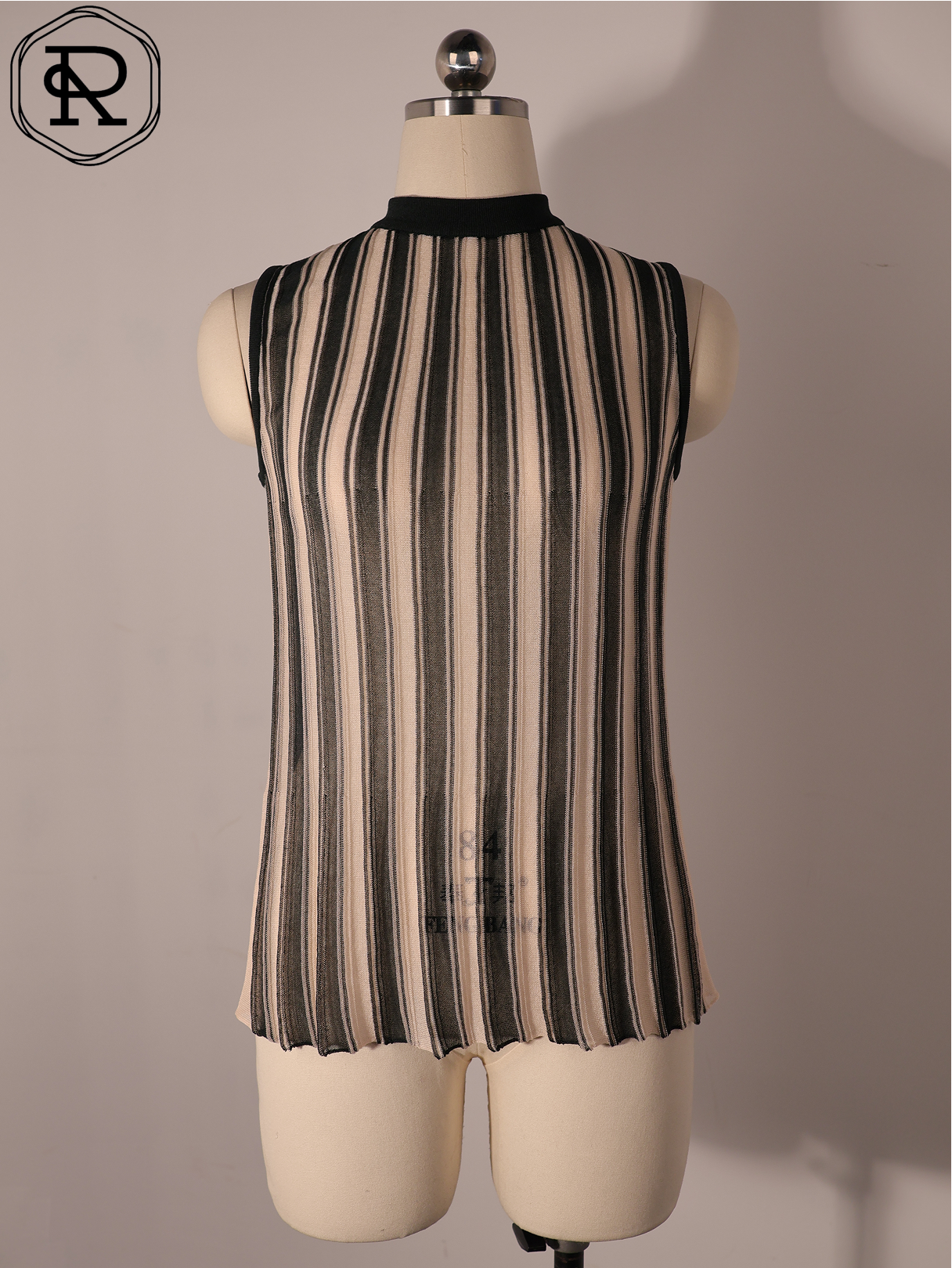 Top de punto pointelle con cuello simulado y rayas verticales